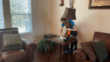 Angela Brown the House Cleaning Guru Cleans Under Lamp